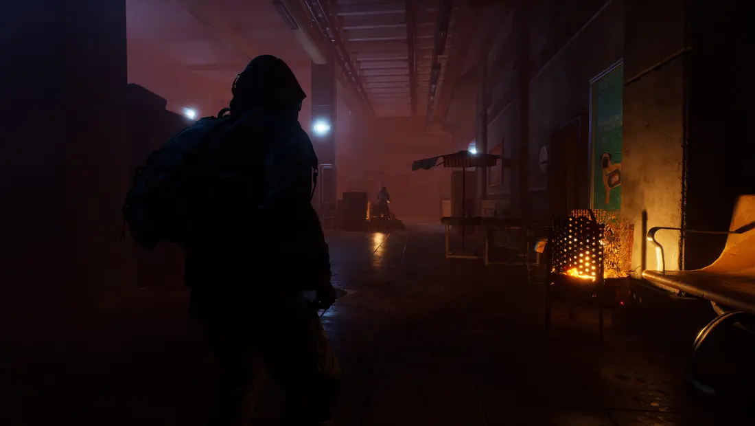 A survivor warming hands at a fire in a snowy shelter in Permafrost